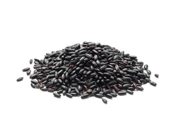Heap of black rice on white background.