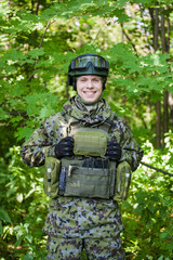 Forces soldiers in the woods with a Kalashnikov
