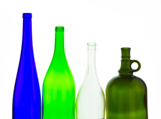 colored empty glass bottles for wine isolated on white background