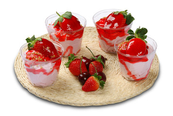 Strawberry mousse served in glass. White background