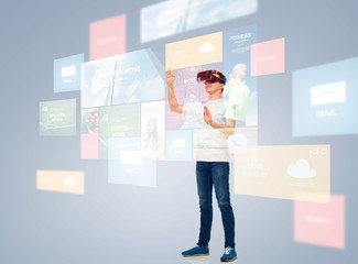 happy man in virtual reality headset or 3d glasses