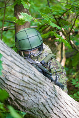 Forces soldiers in the woods with a Kalashnikov