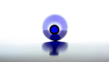 Blue empty bottle on a white background