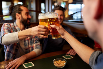 happy male friends drinking beer at bar or pub