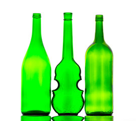 colored empty glass bottles for wine isolated on white background