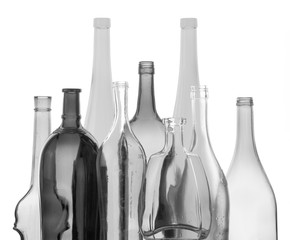 colored empty glass bottles for wine isolated on white background