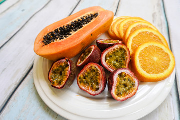 Tropical exotic fruit plate on wooden background