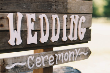 White letters 'Wedding' put over a wooden board