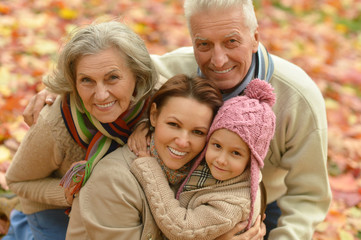 Fototapeta premium Family relaxing in autumn park