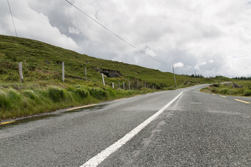 Fototapeta na wymiar asphalt road at connemara in ireland