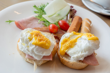 Breakfast Thai modern Hotel. English breakfast style. egg on toast with sausage and ham, vegetable salad. Design for Breakfast at Hotel in Thailand. Close up