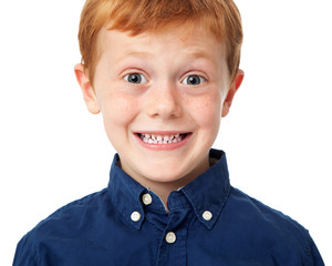 Close up face of a smiling ginger boy isolated on white background