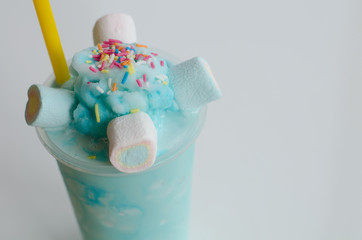 Iced blue sky milk shake whipped topping on the top with Marshma