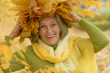 senior woman in  autumn park
