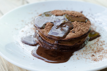 Chocolate pancakes with chocolate sauce