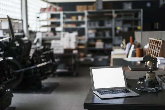 Laptop in typesetting shop