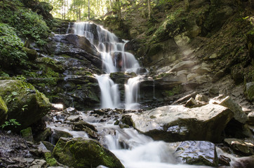 Fototapeta na wymiar Waterfall in the Ukrainian Carpathians 