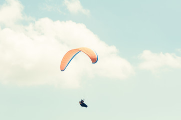 One paraglider on a summer blue sky