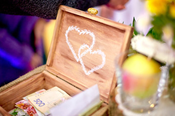 Naklejka na ściany i meble Wedding decor. Wooden chest with printed white hearts
