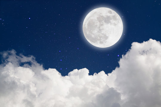 Romantic Moon In Starry Night Over Clouds.