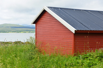 Fototapeta na wymiar Northern landscape with red house