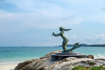 The mermaid statue with seascape background at Samet island