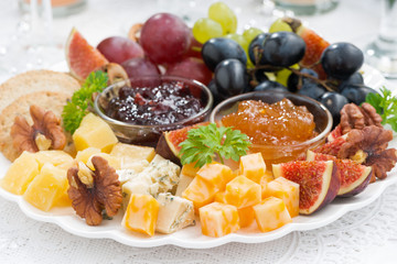 cheese and fruit plate to the holiday, closeup