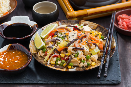 fried rice with tofu and vegetables on table