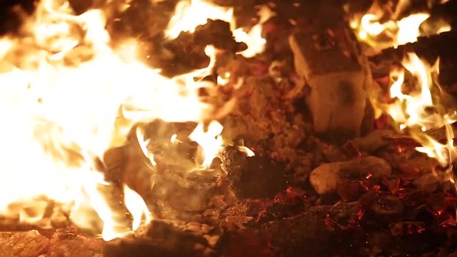 Wood burning in a fire outside in the country