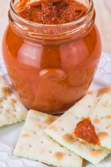 Roasted red pepper spread and crackers.