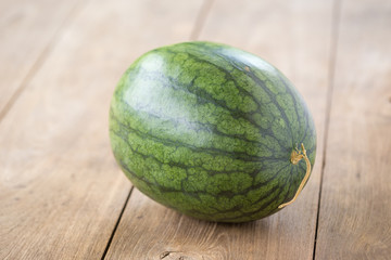 watermelon on brown wooden background