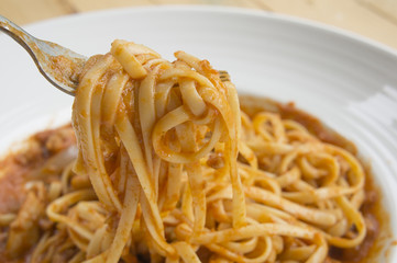 fresh homecook spaghett on wooden table