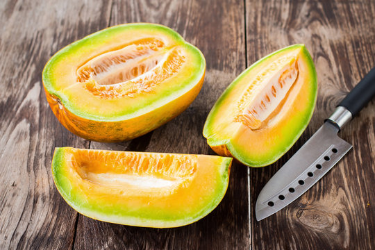 honeydew melon on a wooden table background