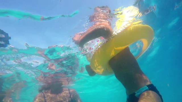Mother and young son swimming in the pool SLOW MOTION 