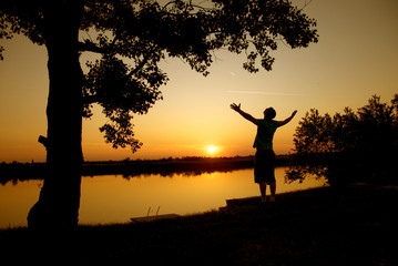 Silhouette of a successful man at sunset