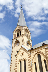 Fototapeta na wymiar Bell tower of the Evangelical-Lutheran Stt. Peter-and-Paul's Cathedral
