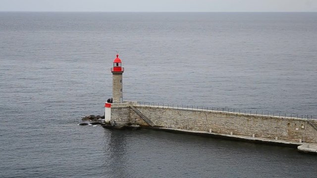 A lighthouse in the sea in Bastia, Corsica, France