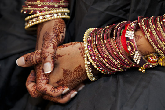 Indian woman's hands with traditional decoration