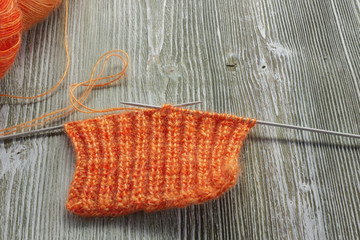Knitting orange mohair wool