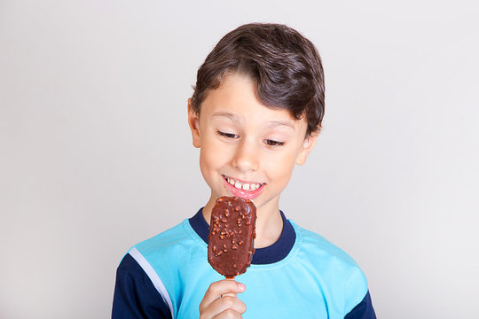 Young Kid Feeling Happy With Chocolate Ice Cream Bar