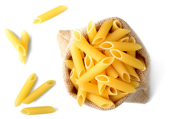 uncooked penne pasta in sack