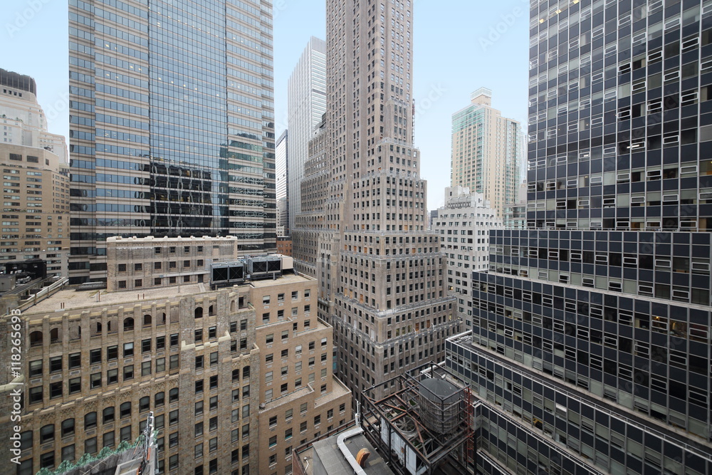 Wall mural cityscape with many high buildings at the autumn day.