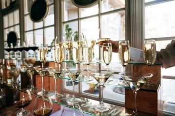 Catering service. Wedding drink bar. waiter pouring champagne for a toast to the bride and groom