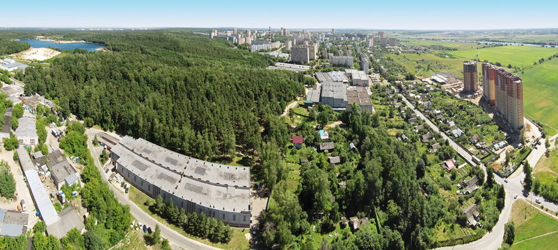 Panorama of equestrian arena Sozidatel after Russian Championship for Dzhigitovka at sunny summer day. Aerial view. (Photo with noise from action camera)