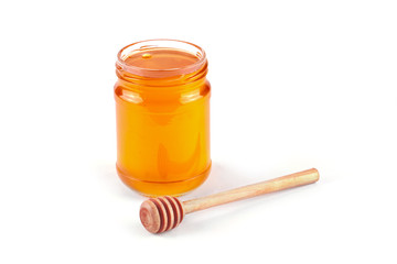 Jar of honey and  honey dipper