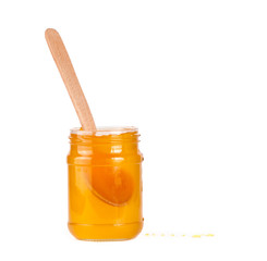 Jar of honey and  honey dipper