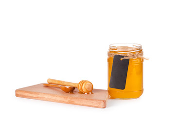 Jar of honey and  honey dipper