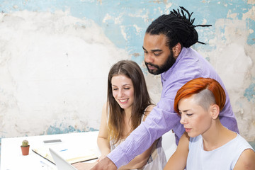 Young people working in the grunge office