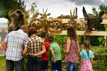 Perekhrest, Ukraine - August 14. 2016: Visitors view trophies during the first festival of hunters.