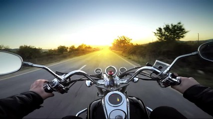 Motorcycle ride pov, road adventure toward sunset, 